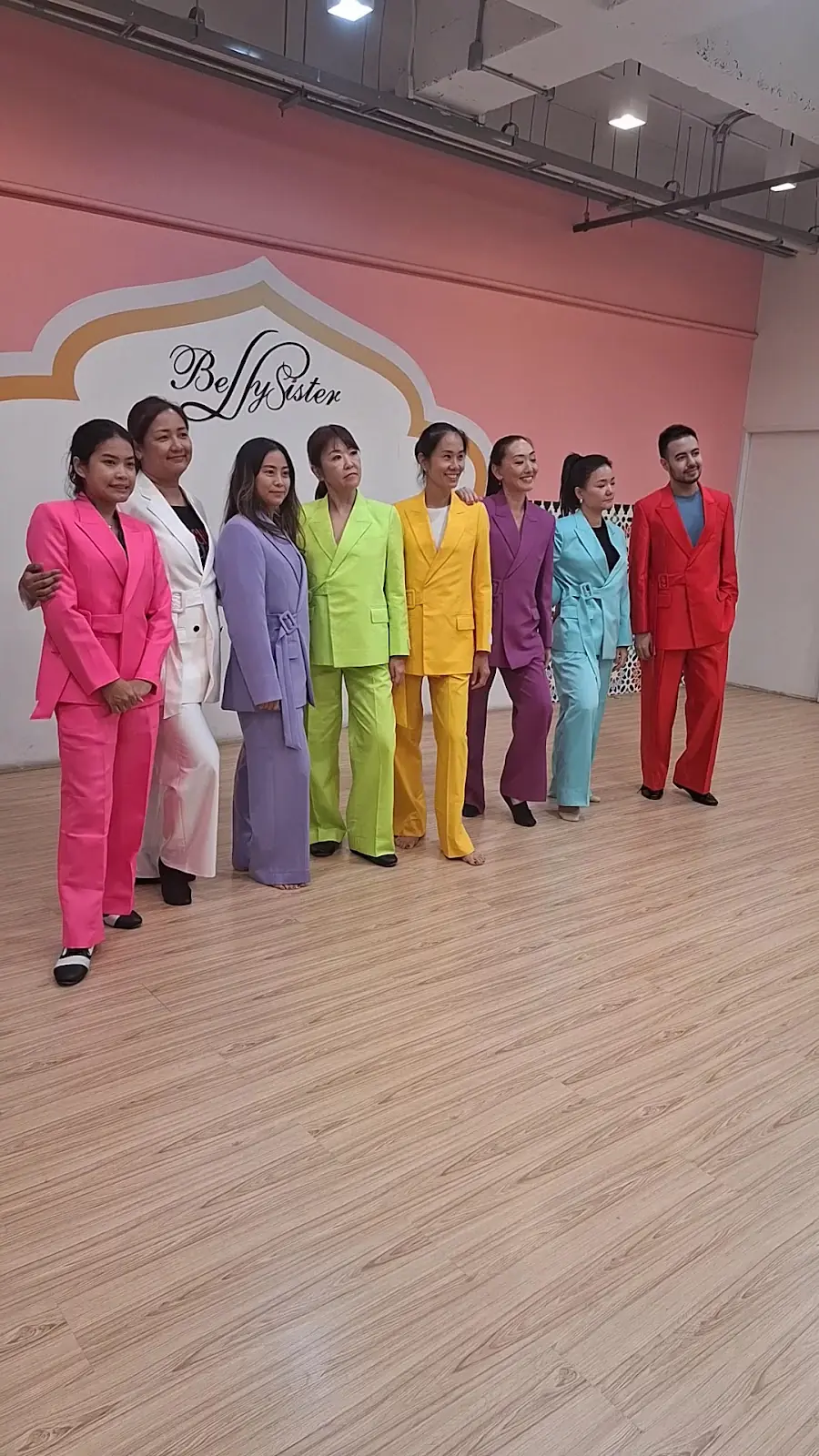 Eight trouser suits from one pattern, lined up in eight colours.