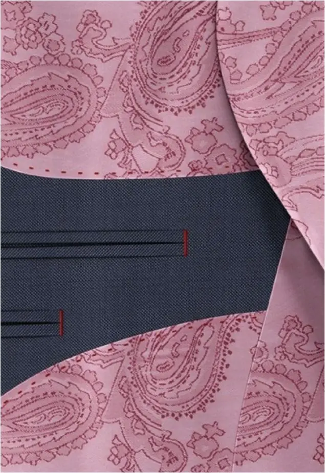 A woven paisley lining behind a navy facing.
